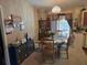 Cozy dining area with a round table and chairs, next to an outside view at 11860 Nw 18Th Pl, Ocala, FL 34482