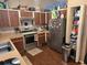 Well-equipped kitchen with stainless steel appliances and wood cabinets at 11860 Nw 18Th Pl, Ocala, FL 34482