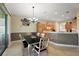A dining area boasts a stylish table, chairs, and sliding glass doors for an airy and inviting space at 12133 Se 91St Ter, Summerfield, FL 34491