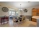 Dining area features a large sliding glass door and stylish decor at 12133 Se 91St Ter, Summerfield, FL 34491