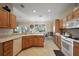 Spacious kitchen with stainless steel appliances and eat-in dining area at 12133 Se 91St Ter, Summerfield, FL 34491