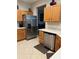 Bright kitchen featuring stainless steel appliances, light countertops, and ample cabinet space at 12133 Se 91St Ter, Summerfield, FL 34491