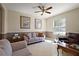 Cozy living room with comfortable seating, neutral decor, and a bright window at 12133 Se 91St Ter, Summerfield, FL 34491