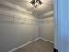 View of closet space with shelving and gray walls at 12199 Se 88Th Ct, Belleview, FL 34420