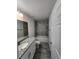 Bathroom features a bathtub, a granite countertop vanity, and tile flooring at 127 Sw Alvarez Rd, Dunnellon, FL 34431