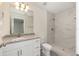 Bathroom featuring a granite vanity and a shower with marble-look tile at 127 Sw Alvarez Rd, Dunnellon, FL 34431