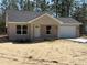 Charming single-story home featuring a neutral stucco finish, attached one car garage, and simple landscaping at 127 Sw Alvarez Rd, Dunnellon, FL 34431