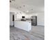 Open kitchen featuring modern appliances, granite countertops, a breakfast bar, and stylish pendant lighting at 127 Sw Alvarez Rd, Dunnellon, FL 34431