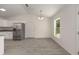 Bright, open space with stainless steel appliances, gray vinyl floors and lots of light at 127 Sw Alvarez Rd, Dunnellon, FL 34431