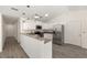 Modern kitchen featuring white cabinets, stainless steel appliances, and granite countertops at 127 Sw Alvarez Rd, Dunnellon, FL 34431