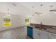 A kitchen area features granite countertops, stainless steel sinks, and pendant lighting at 127 Sw Alvarez Rd, Dunnellon, FL 34431