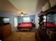 Bright blue Primary bedroom featuring carpet, closet, ceiling fan and window at 19726 Sw 95Th St, Dunnellon, FL 34432