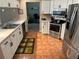 Well-equipped kitchen with stainless steel appliances and white cabinetry at 19726 Sw 95Th St, Dunnellon, FL 34432