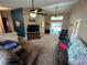 Spacious living room featuring high ceilings, ceiling fans, and comfortable seating at 19726 Sw 95Th St, Dunnellon, FL 34432