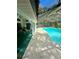 Spacious screened-in pool area with ample seating for outdoor entertaining at 19726 Sw 95Th St, Dunnellon, FL 34432