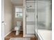 Bright bathroom with a shower, mosaic tile accents, and a window providing natural light at 2318 Nw 50Th Ave, Ocala, FL 34482