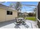 Covered patio with dining furniture, providing an outdoor space for entertaining with views of backyard at 2318 Nw 50Th Ave, Ocala, FL 34482