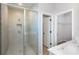 Modern bathroom with glass enclosed shower, tile surround, and dual sink vanity at 3085 Sw 131St Place Rd, Ocala, FL 34473