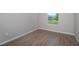 Bedroom featuring tile floors and a view of the backyard through one window at 3085 Sw 131St Place Rd, Ocala, FL 34473
