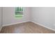 Bedroom featuring tile floors and a view of the front yard through one window at 3085 Sw 131St Place Rd, Ocala, FL 34473