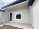Covered lanai featuring neutral siding, and a sliding glass window to the backyard at 3085 Sw 131St Place Rd, Ocala, FL 34473
