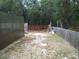 Spacious backyard with partial fencing, offering privacy and space for outdoor activities at 409 Marion Oaks Dr, Ocala, FL 34473