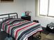 Comfortable bedroom with dark-colored floors, a window, and a ceiling fan at 409 Marion Oaks Dr, Ocala, FL 34473