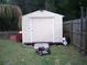 Outdoor shed provides additional storage space for tools and equipment at 409 Marion Oaks Dr, Ocala, FL 34473