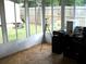 Bright sunroom with natural light, providing an ideal space for a home office at 409 Marion Oaks Dr, Ocala, FL 34473