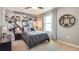 Stylish bedroom with a unique motorcycle-themed mural, ceiling fan, and bedside table lamp at 4266 Sw 53Rd Lane Rd, Ocala, FL 34474