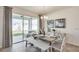 Cozy dining room with a modern table, bench seating, and a sliding glass door leading to the patio at 4266 Sw 53Rd Lane Rd, Ocala, FL 34474