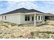 A modern home with a covered patio, expansive backyard, and excellent natural light at 4381 Sw 90Th Pl, Ocala, FL 34476