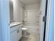 Bathroom features a shower-tub combo, granite countertop vanity, and a toilet at 4381 Sw 90Th Pl, Ocala, FL 34476