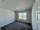 Bright bedroom with large window and plush carpet creates a cozy and inviting atmosphere at 4381 Sw 90Th Pl, Ocala, FL 34476