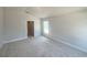 Bedroom with plush carpeting, natural light, and neutral walls, ready for personalization at 4381 Sw 90Th Pl, Ocala, FL 34476