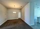 Bright dining area with a modern chandelier, neutral walls, and carpet flooring at 4381 Sw 90Th Pl, Ocala, FL 34476