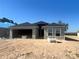 Unfinished single-Gathering home featuring block construction and an attached two-car garage at 4381 Sw 90Th Pl, Ocala, FL 34476