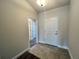 Hallway with tiled floors leads to rooms, providing smooth transitions between spaces at 4381 Sw 90Th Pl, Ocala, FL 34476
