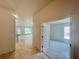 Hallway view leading to living spaces, showcasing connectivity and flow of the home at 4381 Sw 90Th Pl, Ocala, FL 34476