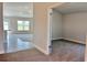 Bright open-concept living area with tiled floors and views to backyard at 4381 Sw 90Th Pl, Ocala, FL 34476