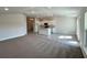 Spacious open-concept living area with modern kitchen featuring granite island and white cabinets at 4381 Sw 90Th Pl, Ocala, FL 34476