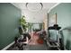 Large exercise room with hardwood floors, natural light, and fitness equipment at 4425 Se 2Nd Pl, Ocala, FL 34471