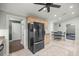 Kitchen with stainless steel refrigerator, tile flooring, and breakfast nook with natural light at 4425 Se 2Nd Pl, Ocala, FL 34471