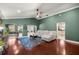 Comfortable living room with hardwood floors, a neutral sofa, and views to other areas at 4425 Se 2Nd Pl, Ocala, FL 34471