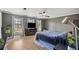 Bright main bedroom with great natural light, wood floors, ceiling fan and an exterior view at 4425 Se 2Nd Pl, Ocala, FL 34471