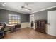 Home office featuring wood floors, two-tone walls, and large window at 4425 Se 2Nd Pl, Ocala, FL 34471