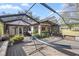 Expansive back patio features a hammock, outdoor seating and lots of plants for outdoor living at 4425 Se 2Nd Pl, Ocala, FL 34471