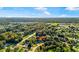 Located in a quiet neighborhood, aerial view of property shows surroundings with beautiful landscaping at 53 Juniper Trail Cir, Ocala, FL 34480