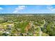 Property with trees surrounding, aerial view shows community with lush landscaping and a great neighborhood at 53 Juniper Trail Cir, Ocala, FL 34480