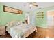 Cozy bedroom featuring hardwood floors and neutral walls at 53 Juniper Trail Cir, Ocala, FL 34480